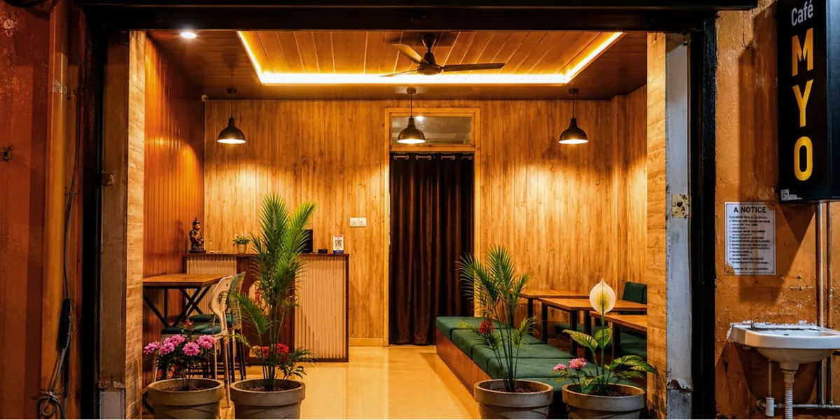 Wood, warm lighting and plants inside Cafe MYO in Rishikesh